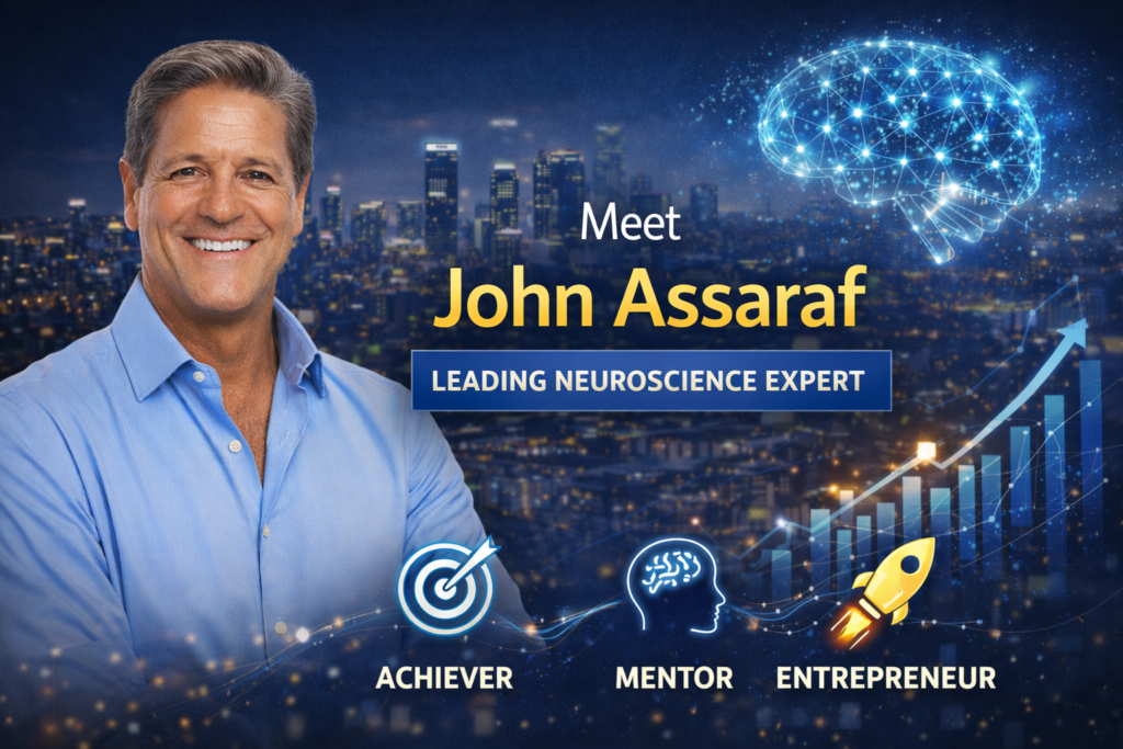 John Assaraf speaking during a business and mindset coaching session in a professional studio setting